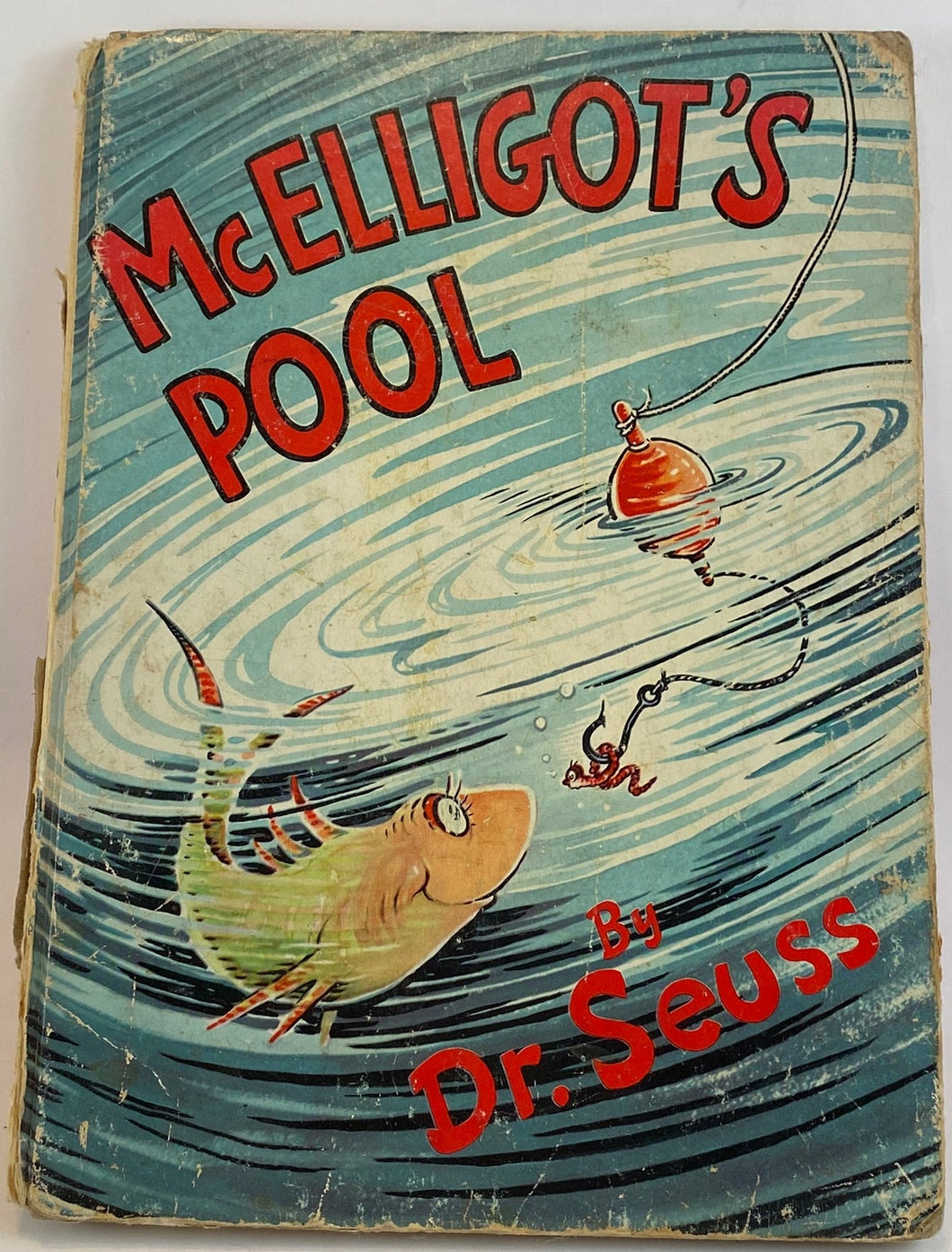 Cover of McElligot's Pool book by Dr. Seuss with a fish in the ocean and a worm on the hook